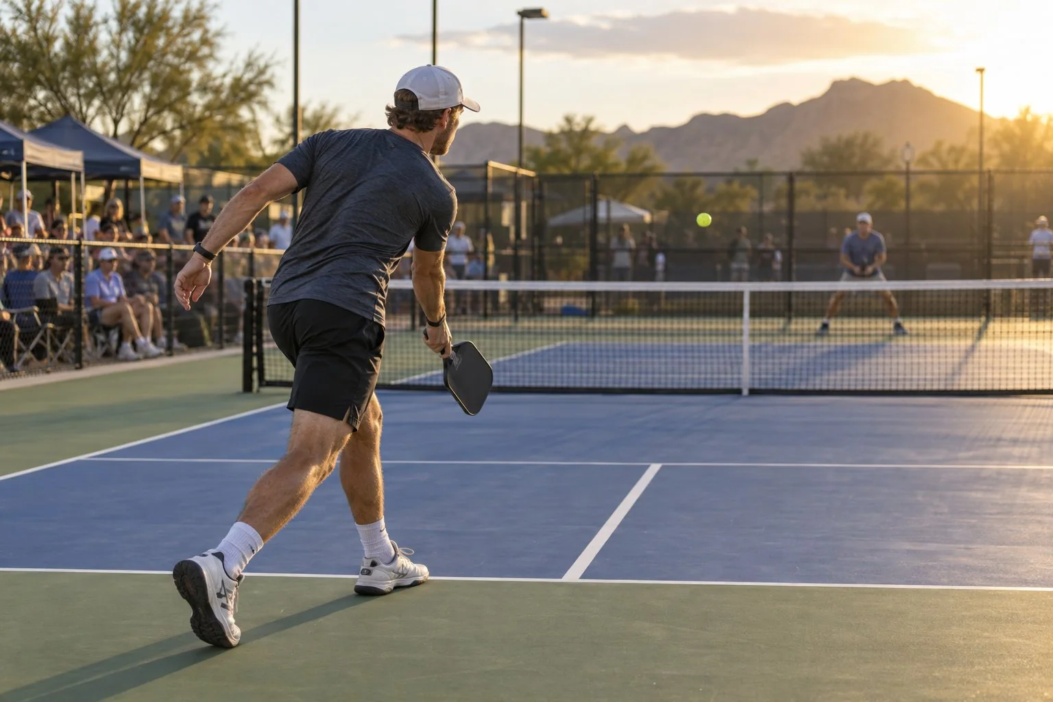 Singles player recovering behind the baseline after a deep serve