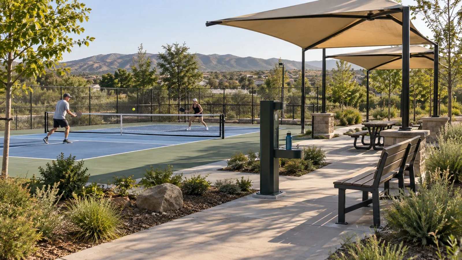 Shade placed beside the pickleball court with clear sightlines and open play area