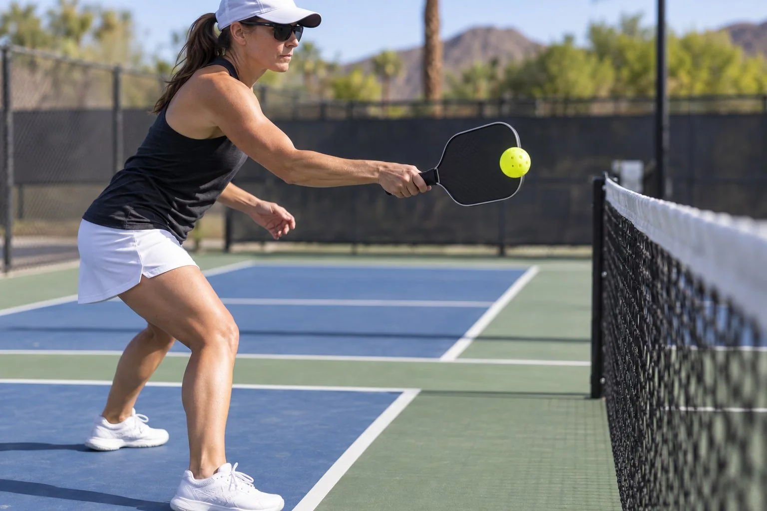 Player executing a compact pickleball punch volley at the kitchen line