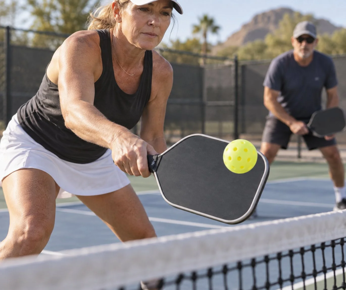 Close-up coaching visual of relaxed pickleball paddle grip pressure