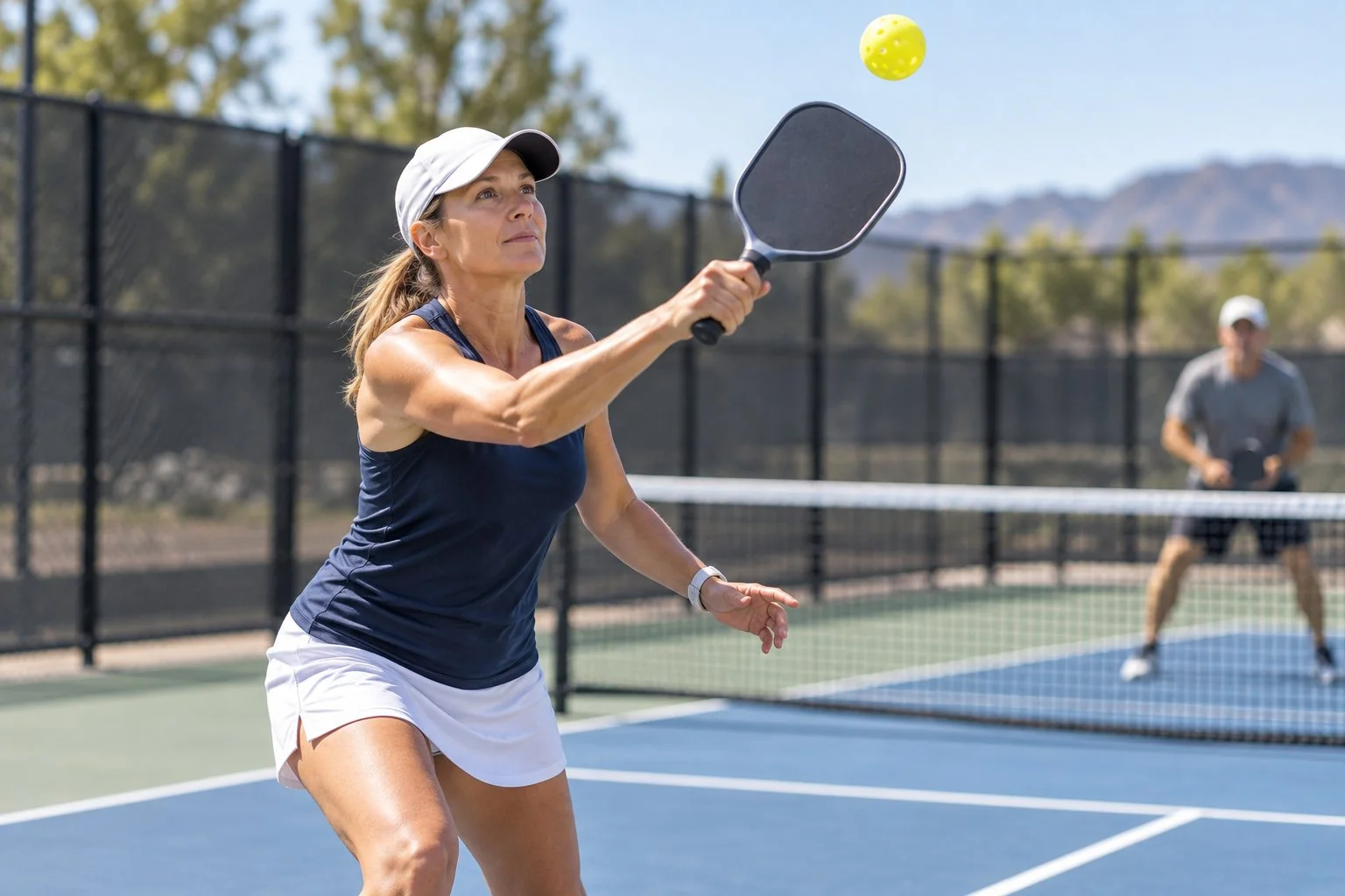Technique-focused close-up of a balanced pickleball lob contact with an open paddle face