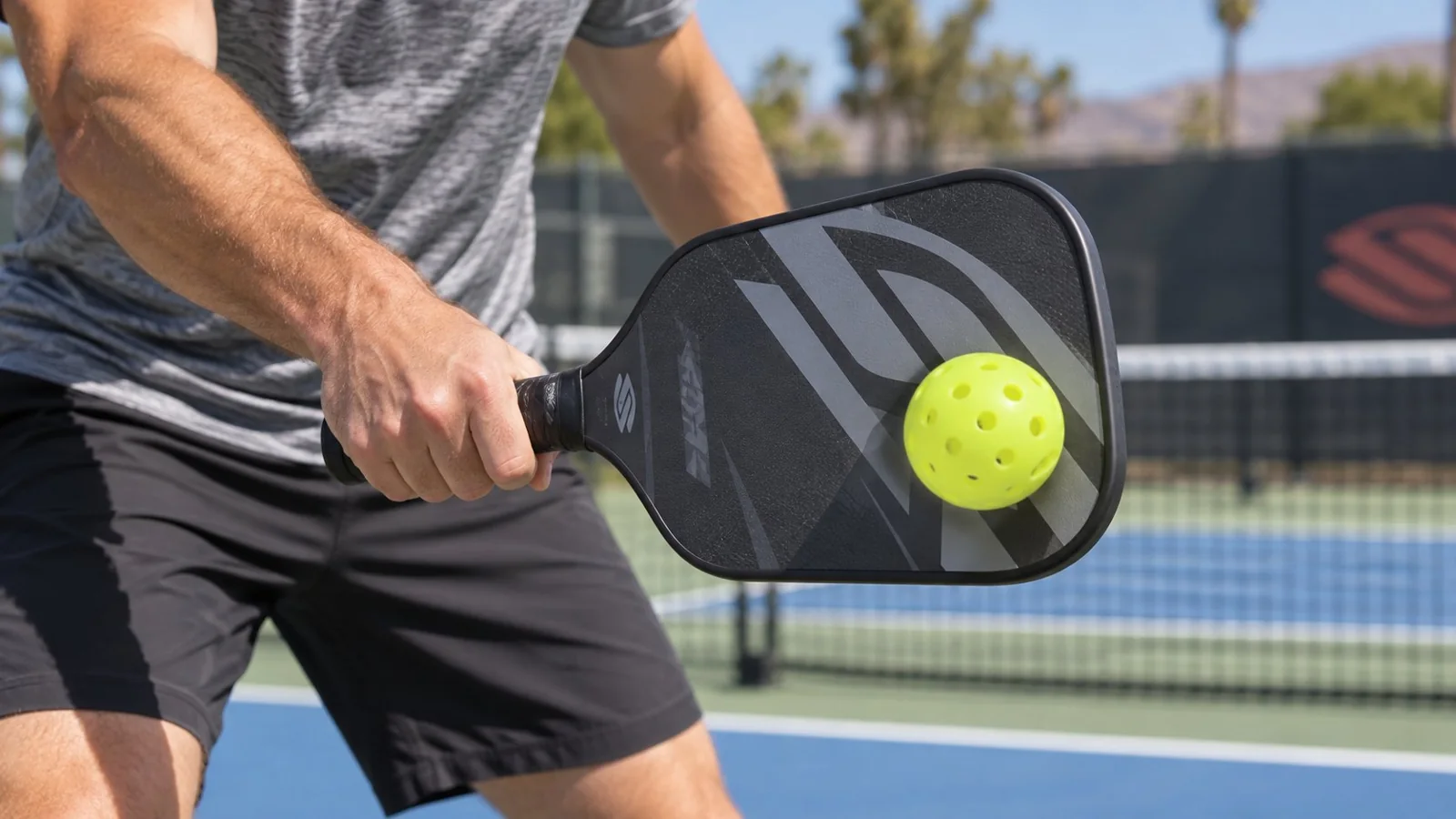 Close instructional view of a compact paddle path and contact point in front of the body